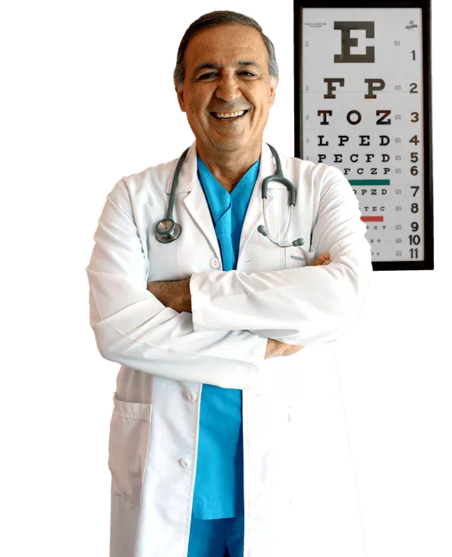 Dr. Osman Fıratlı standing beside an eye chart